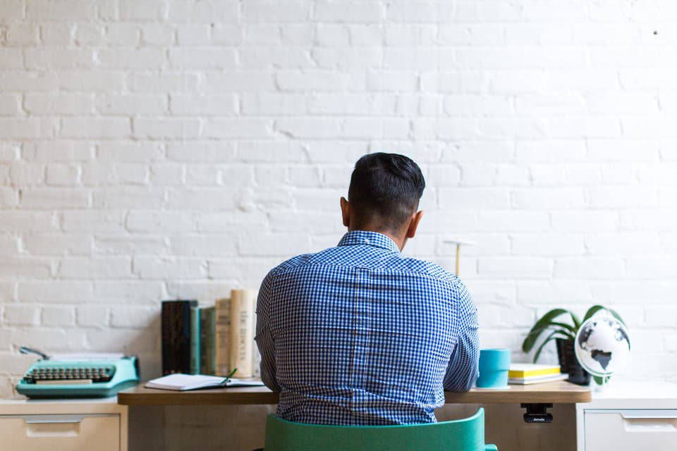 Person working at a bright, minimal desk